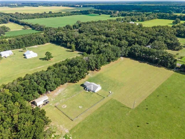 birds eye view of property with a rural view