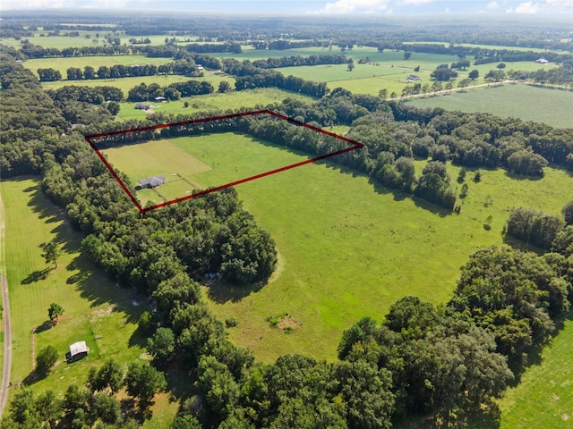 birds eye view of property with a rural view