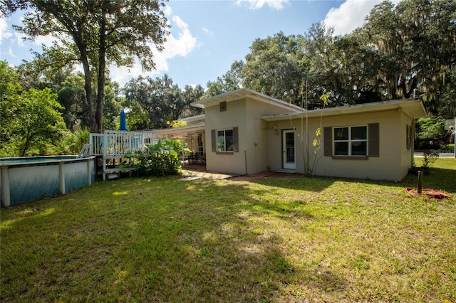 back of house with a yard