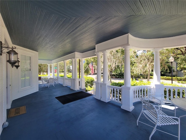 view of patio featuring a porch