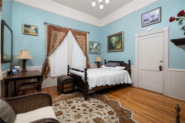 bedroom with hardwood / wood-style flooring