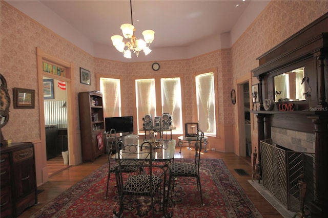 dining room with an inviting chandelier and light hardwood / wood-style flooring