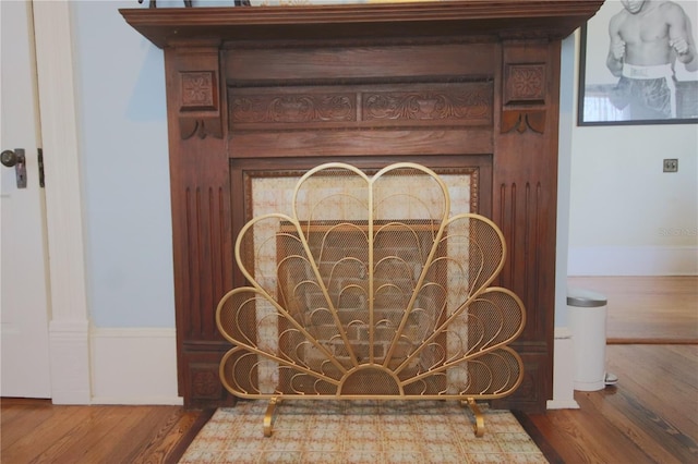 interior details featuring hardwood / wood-style floors