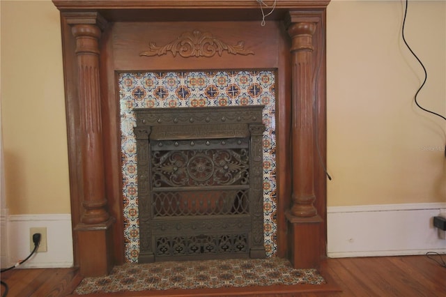 details with a fireplace and hardwood / wood-style floors