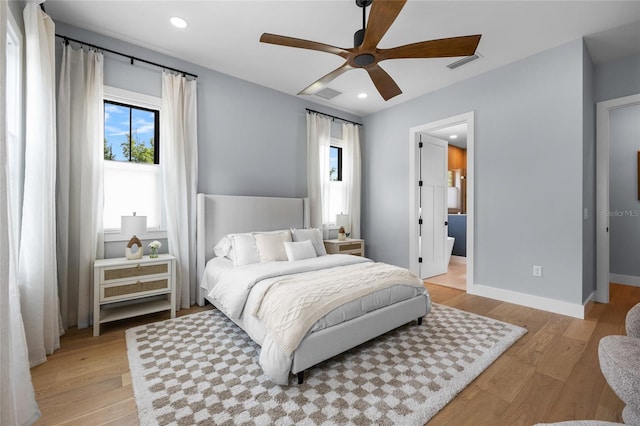 bedroom featuring recessed lighting, light wood-style floors, visible vents, and baseboards