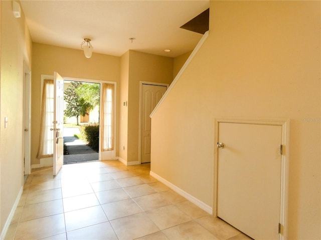 entrance foyer with light tile patterned flooring