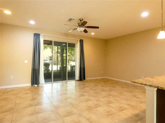 unfurnished room with ceiling fan