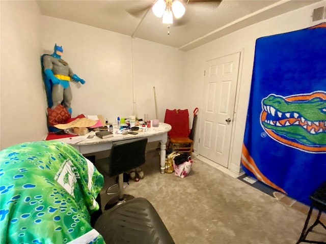 interior space featuring ceiling fan and carpet floors