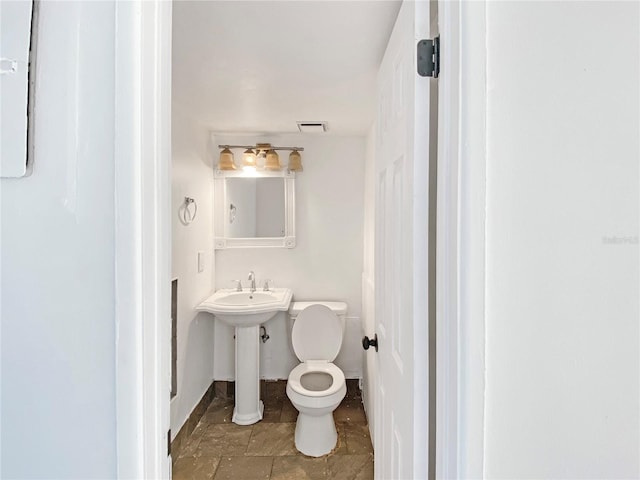 bathroom with toilet and sink