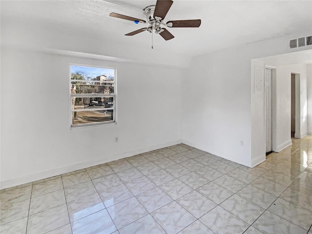 unfurnished room with ceiling fan