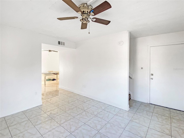 spare room with ceiling fan