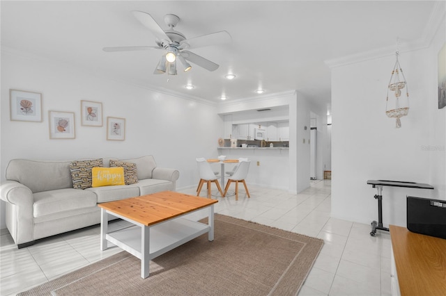 living room featuring ornamental molding, ceiling fan, and light tile patterned floors