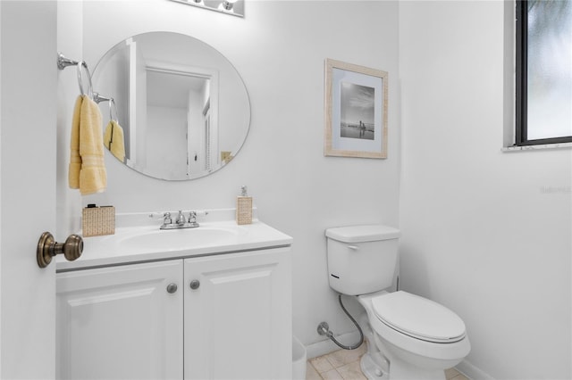 bathroom with vanity, toilet, and tile patterned floors