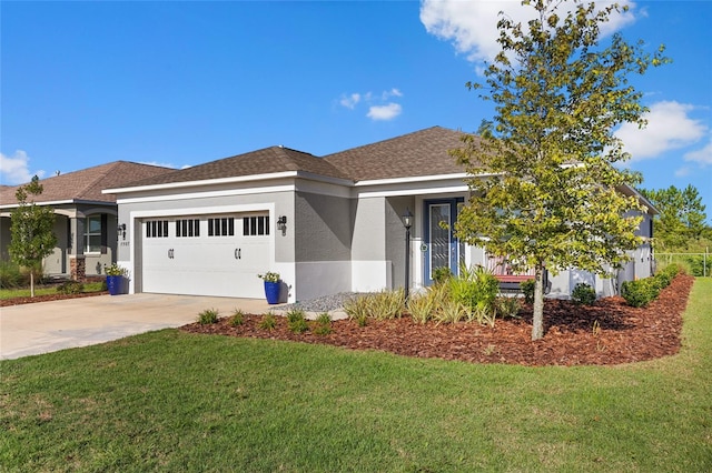 view of front facade with a garage and a front lawn