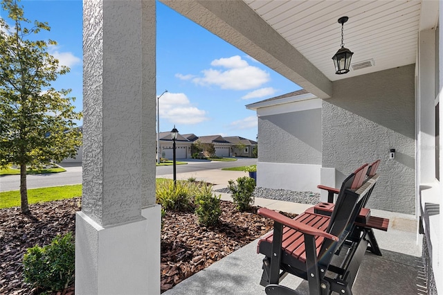 view of patio with a garage