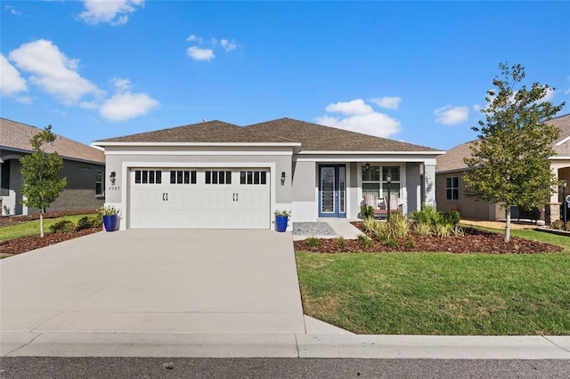 ranch-style home featuring a garage and a front yard