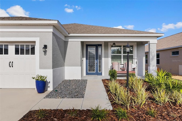 property entrance featuring covered porch and a garage