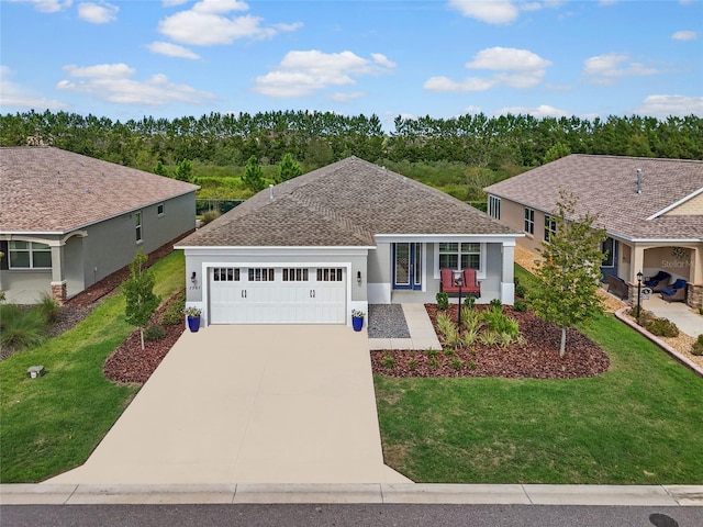 single story home with a garage and a front lawn