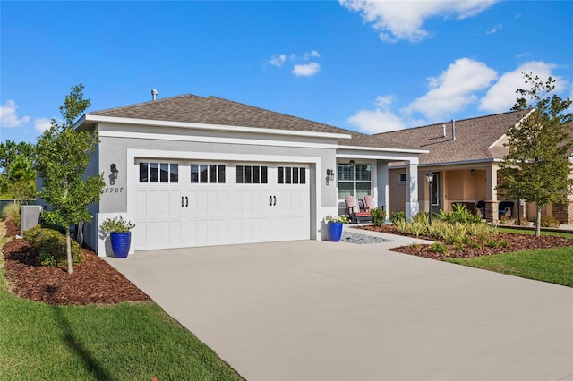 ranch-style home featuring a garage and a front lawn