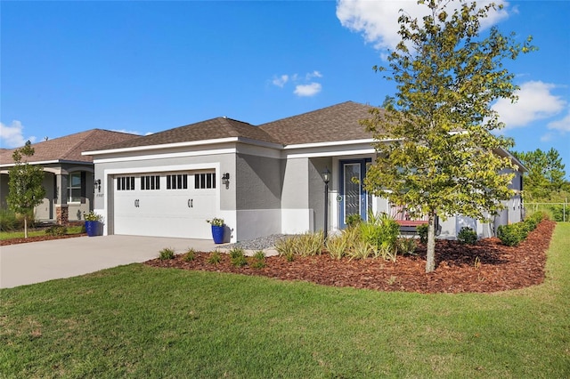 view of front of house with a garage and a front yard