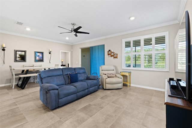 living room with ornamental molding, ceiling fan, and light tile patterned flooring