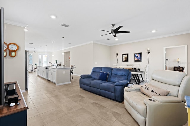 tiled living room with crown molding, sink, and ceiling fan