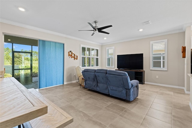 living room with crown molding and a wealth of natural light