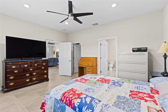 tiled bedroom featuring ensuite bathroom and ceiling fan