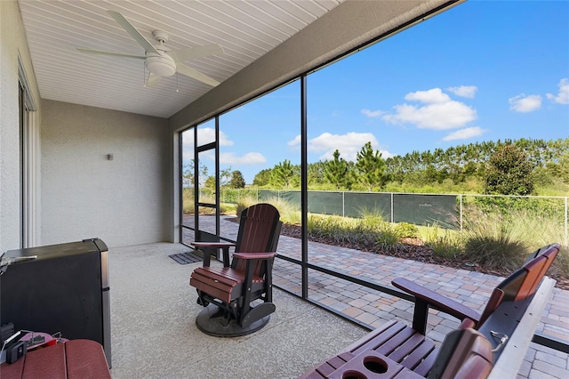 sunroom / solarium with ceiling fan