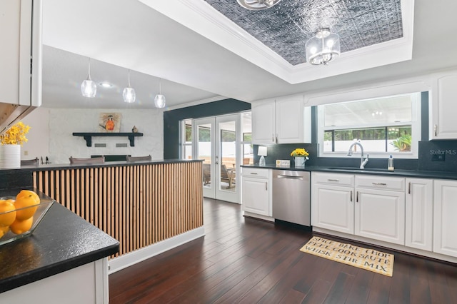 kitchen featuring dishwasher, dark wood-type flooring, white cabinets, a raised ceiling, and french doors