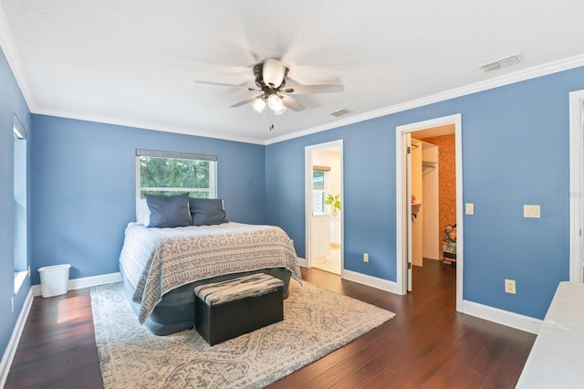 bedroom with ceiling fan, ornamental molding, and dark wood-type flooring