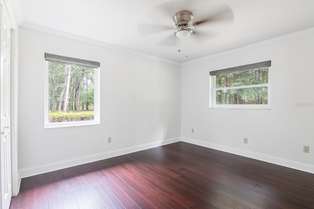 unfurnished room with ornamental molding, dark hardwood / wood-style floors, and ceiling fan