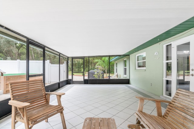 unfurnished sunroom with plenty of natural light