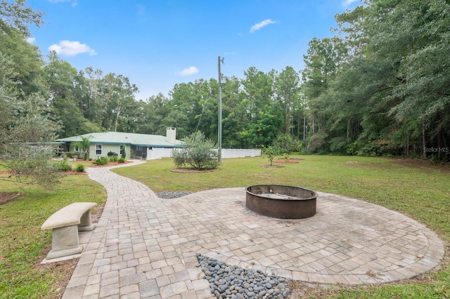 view of patio featuring an outdoor fire pit