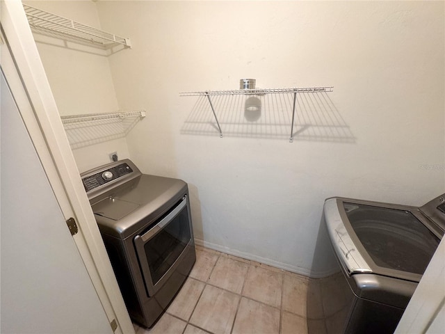laundry area with washing machine and dryer and laundry area