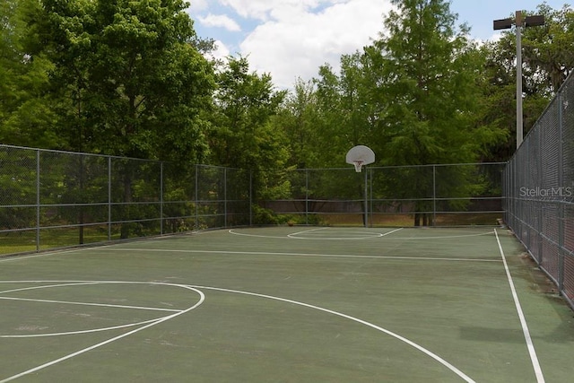 view of sport court with community basketball court and fence