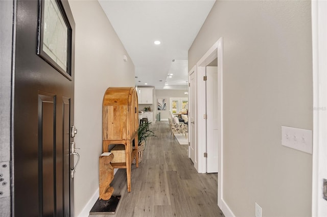 corridor featuring hardwood / wood-style flooring