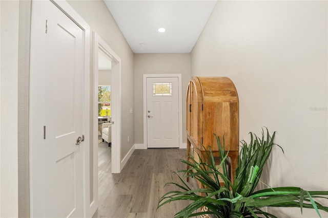 doorway to outside with light hardwood / wood-style floors