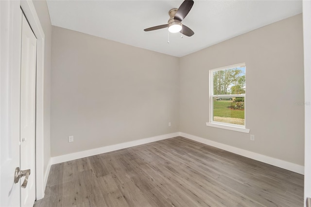 unfurnished bedroom with a closet, light hardwood / wood-style flooring, and ceiling fan