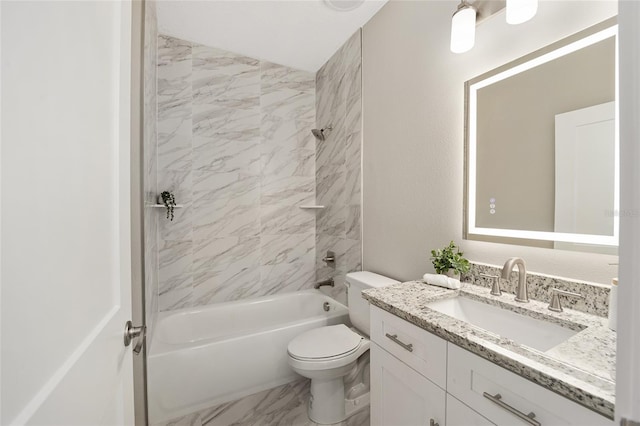 full bathroom with vanity, toilet, and tiled shower / bath