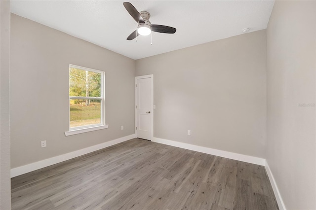 unfurnished room with ceiling fan and light hardwood / wood-style flooring