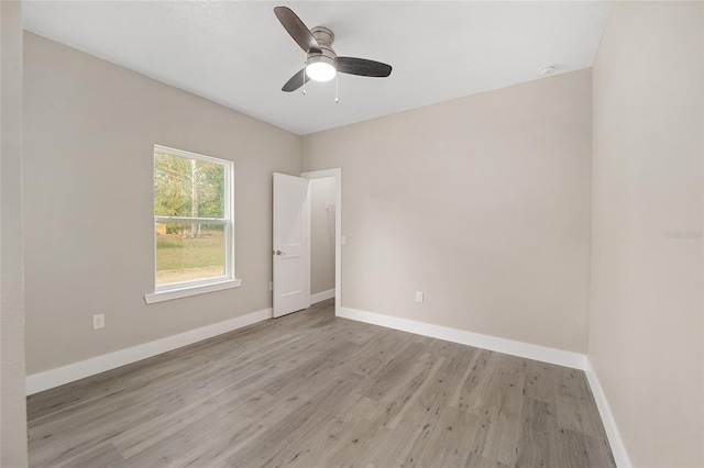 unfurnished room with ceiling fan and light wood-type flooring