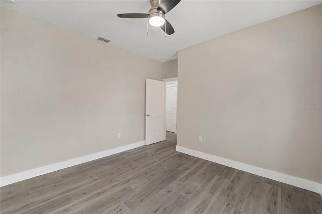 empty room featuring light hardwood / wood-style floors and ceiling fan