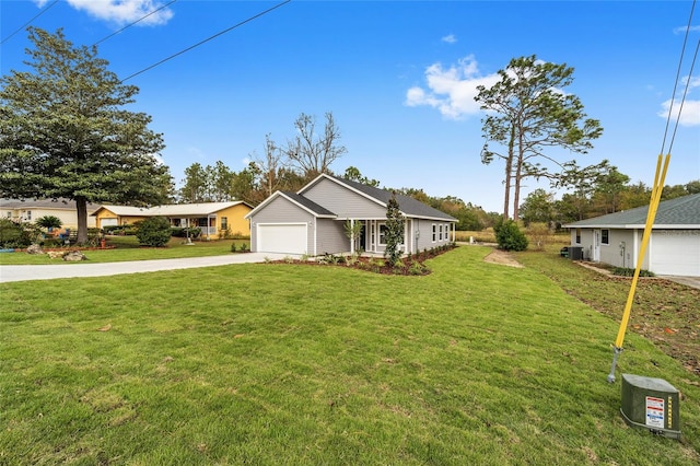 single story home featuring a front lawn and a garage