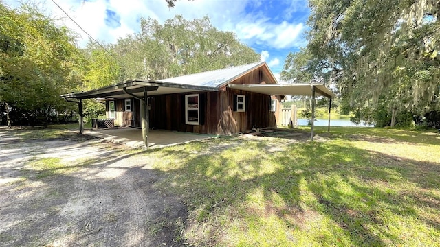 view of front of property with a water view and a front yard