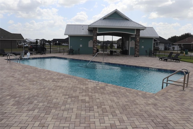 view of pool featuring a patio area