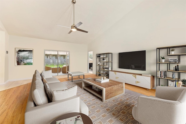 living room with ceiling fan, hardwood / wood-style floors, and high vaulted ceiling