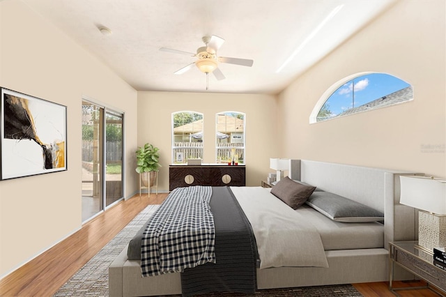 bedroom with access to exterior, light hardwood / wood-style floors, and ceiling fan