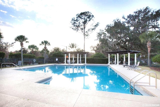 view of pool featuring a patio and a pergola