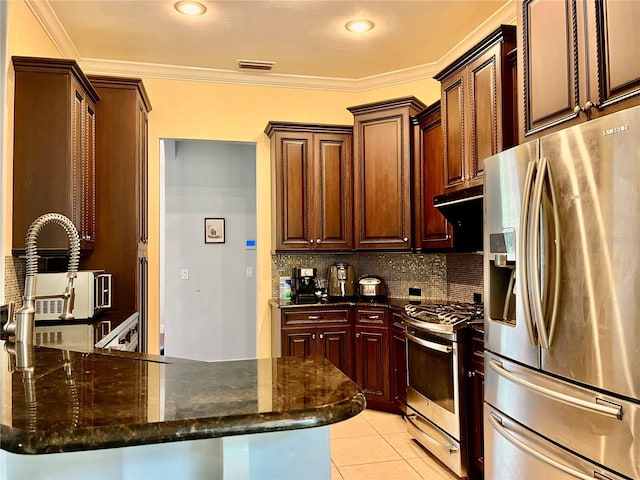 kitchen with stainless steel appliances, kitchen peninsula, dark stone countertops, and crown molding